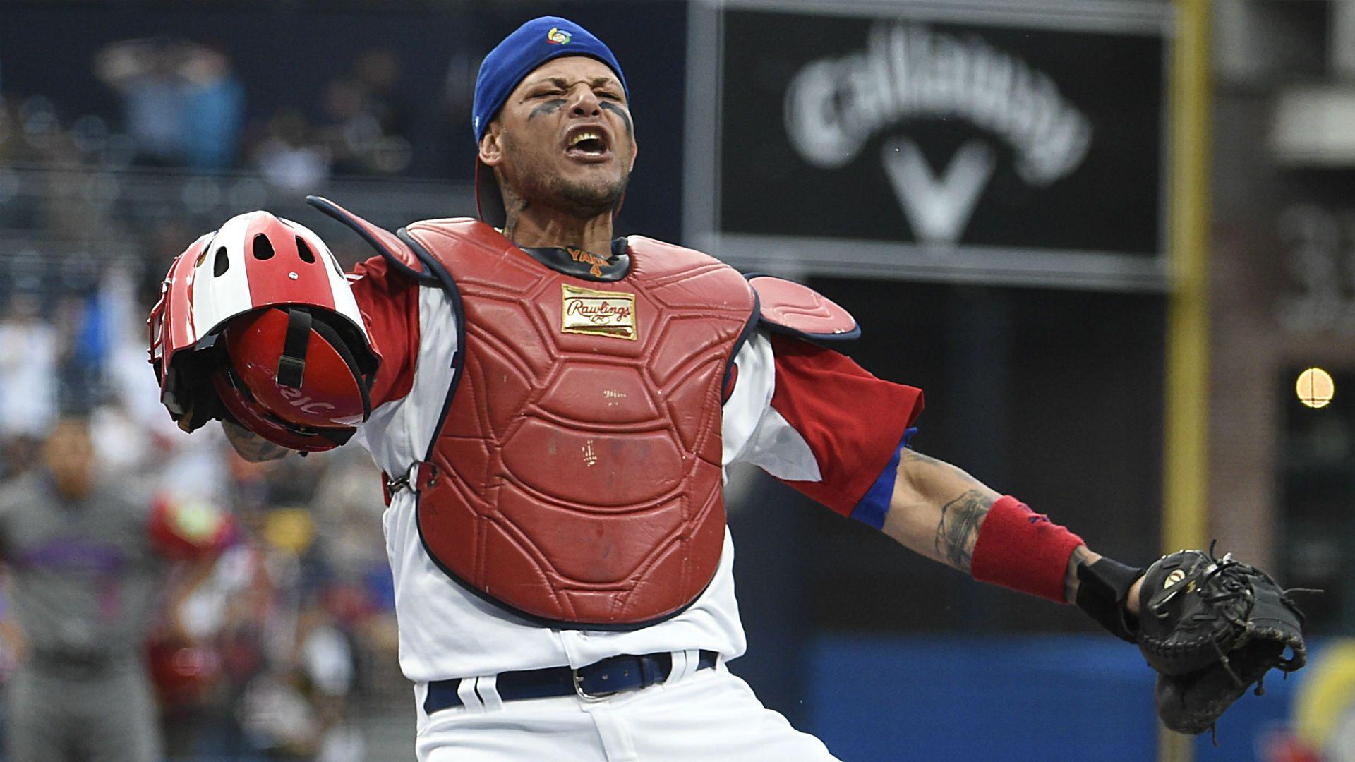 The internet wants to know how a ball got stuck to Yadier Molina's